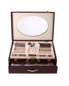 72-piece silver spoon set with golden pattern