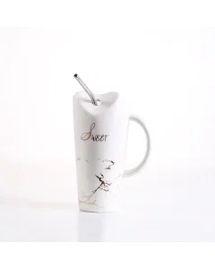 A white ceramic cup with the vampire