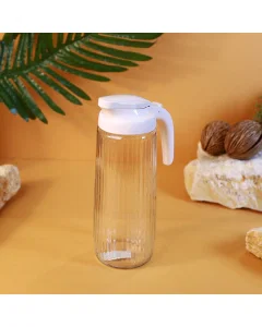 Glass jake with a pink lid